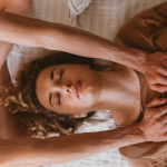 A yoga instructor guides a student through a practice focused on yoga and chakras.