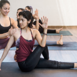 A yoga teacher walks her student through her new organized sequence.