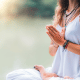 Prayer hands is one of the top yoga poses for gratitude, as shown in the image.