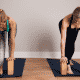 Two yoga instructors use yoga modification blocks during their sequence.