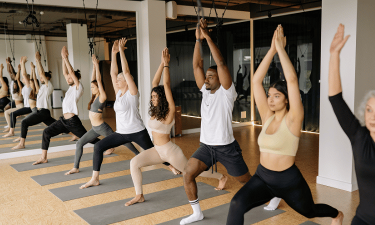 A class tackles Iyengar yoga, a type of yoga practice.