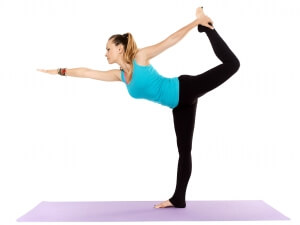 A yoga teacher shows off her dancer pose, another yoga pose for gratitude.