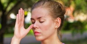 girl doing breathing exercises. pranayama and yoga.